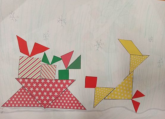 Praca Małgosi i Ksawerego renifer ciągnący sanie pełne prezentów